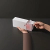The white paper box packaging box can be opened by hand to reveal the filling inside Specification image